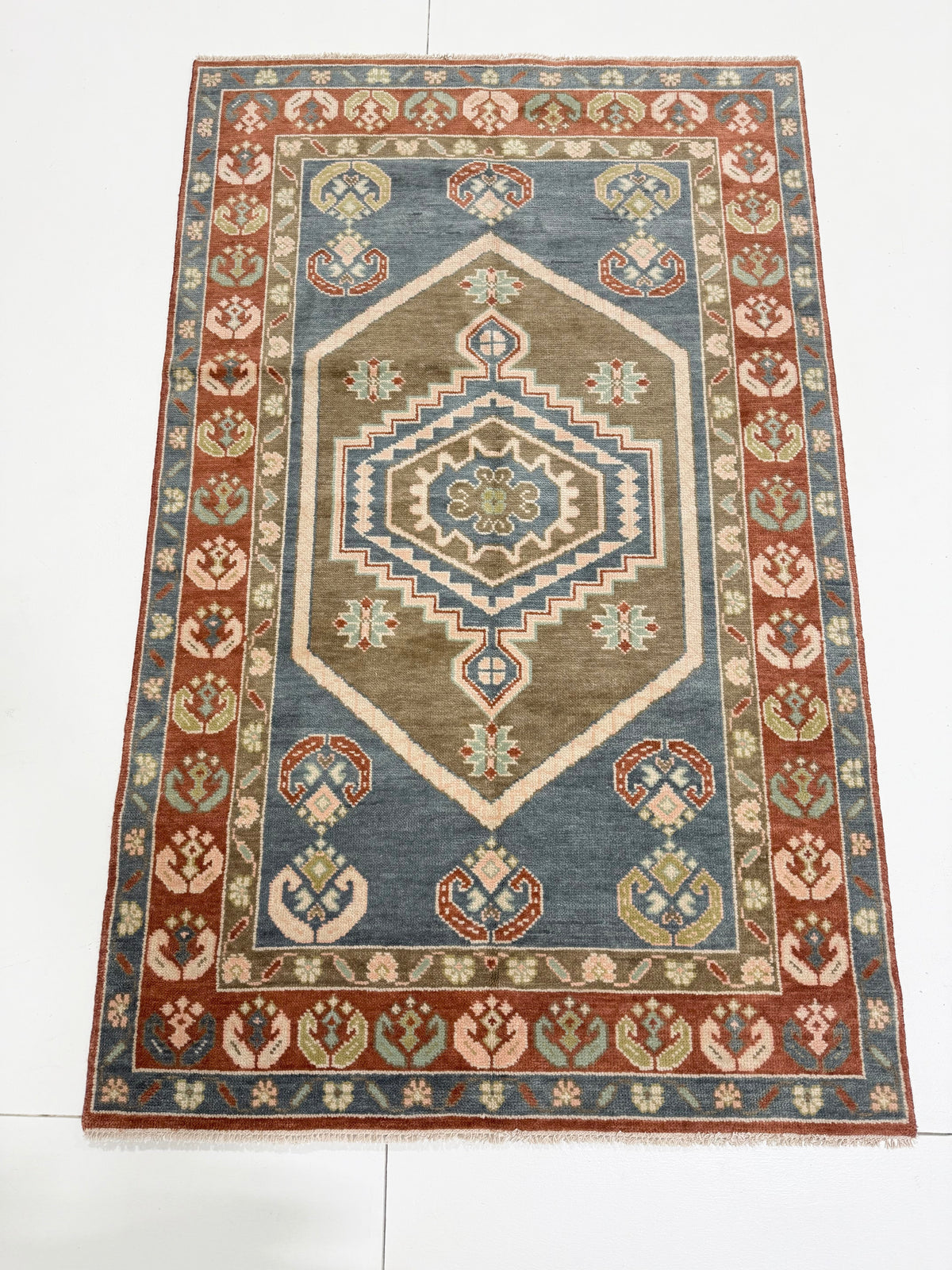 Charlotte Modern Oushak rug, medium blue, olive, rust, blush, mint green, light green — hand-knotted wool area rug