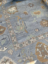 Mae modern Oushak rug with a blue-gray foundation and cream, mustard, sage, and brown accents, hand-knotted wool